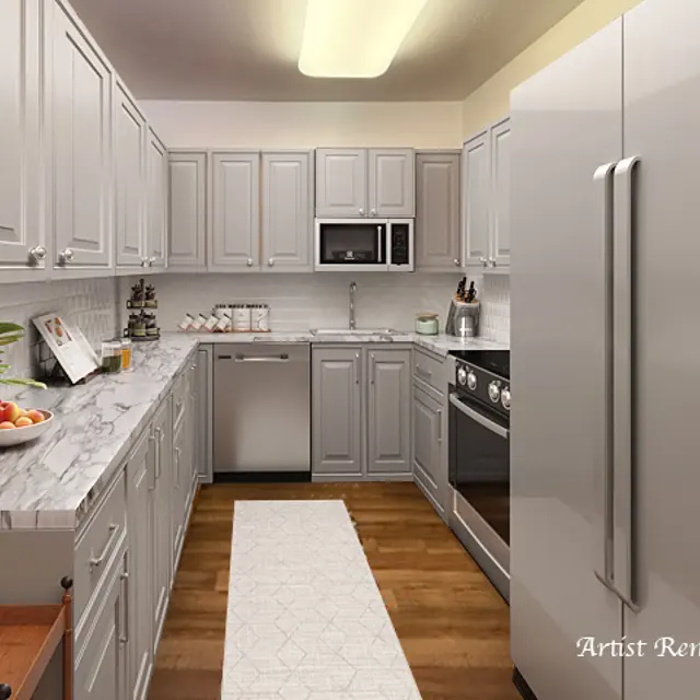 Contemporary Kitchen Design A stylish kitchen featuring gray cabinetry, marble countertops, and stainless steel appliances. A light-colored rug runs along the floor, and a small vase of flowers is on the counter.