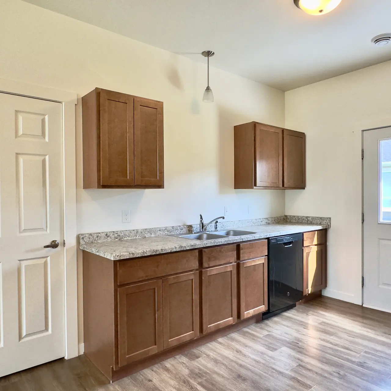apartment kitchen Modern kitchen in an apartment with black appliances and stylish finishes