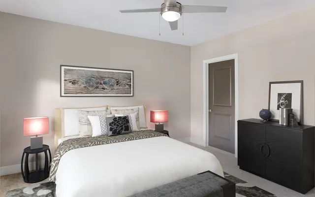 Interior of Vera Apartments in Jacksonville FL - Corner, Ceiling Fan, Device bedroom with bed and dresser