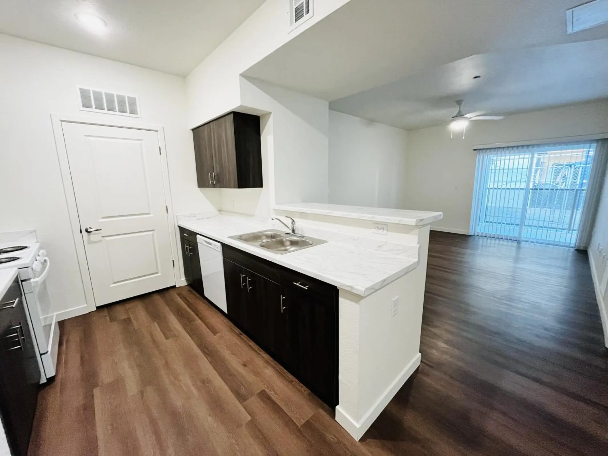 Open kitchen and living area with a counter between the spaces.