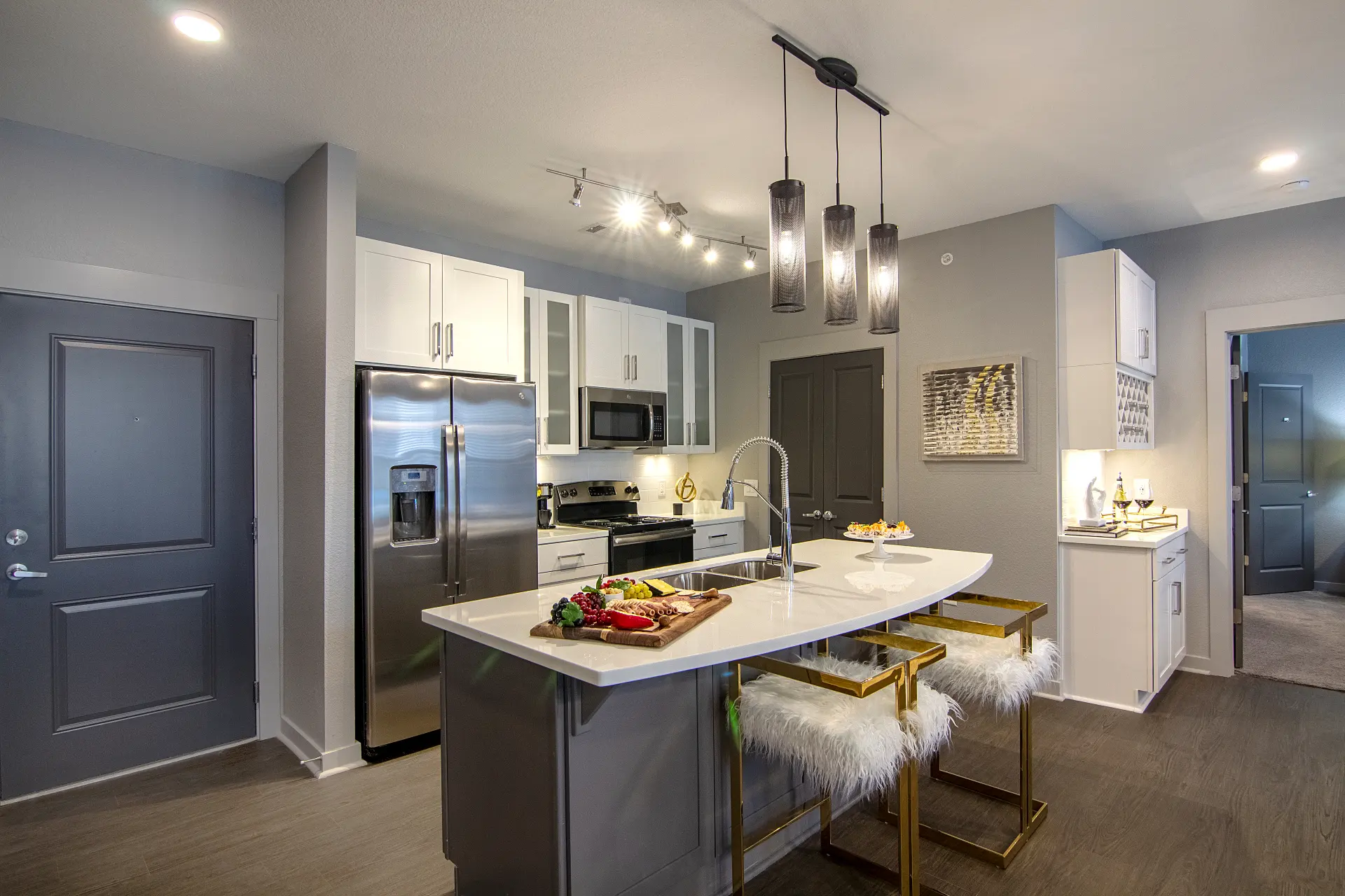 Photo of the kitchen and built-in bar in a two-bedroom apartment at The Pointe North Hills.
