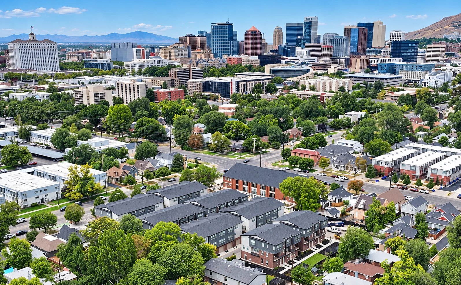 Urban Landscape: City and Nature A panoramic view of a city skyline surrounded by greenery and residential buildings.