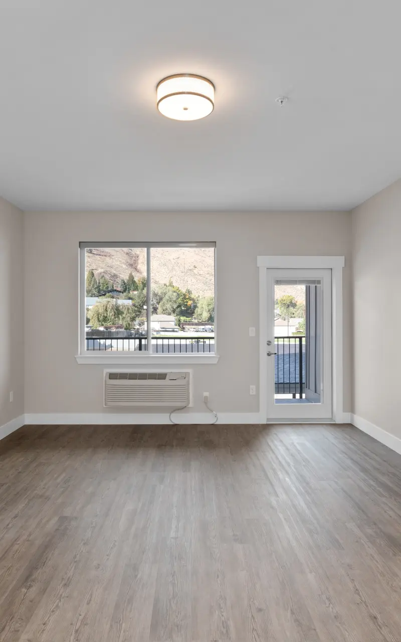 An unfurnished apartment, showcasing empty rooms with bare floors and walls, providing a blank canvas for personalization and decor