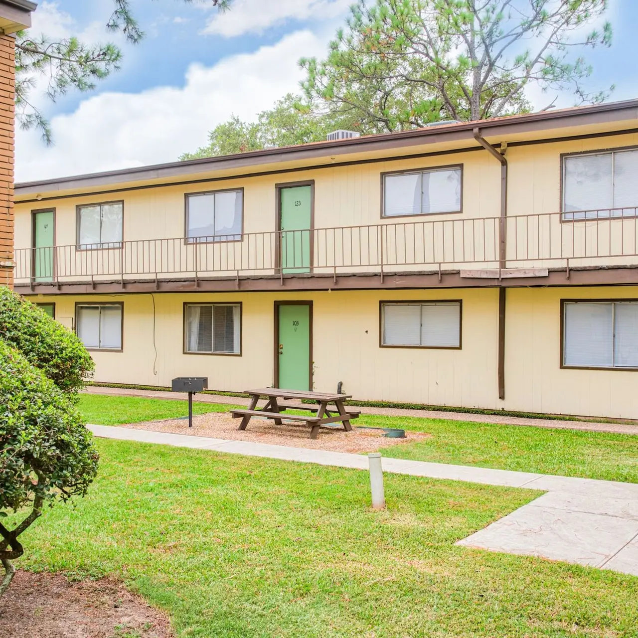 La Serena Apartments - Courtyard,Bush, Bench