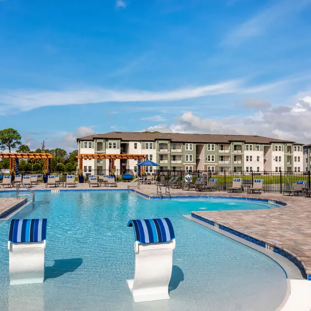 resort style pool with beach like entrance