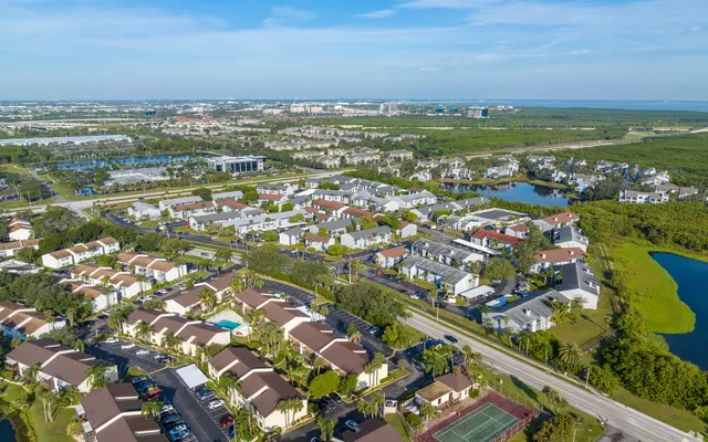 Suburban Community Aerial View Aerial view of a suburban neighborhood with houses, roads, and green spaces.