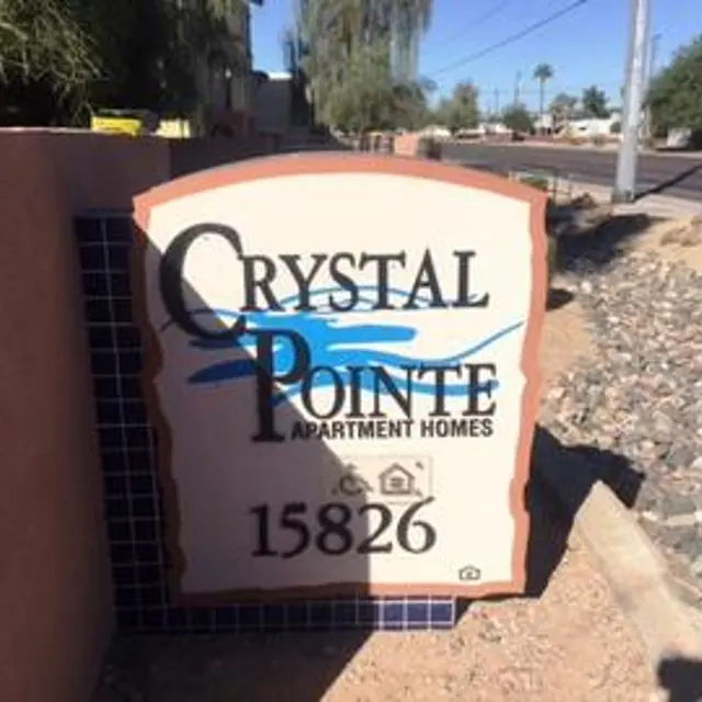 Crystal Pointe Apartment Homes Sign Sign for Crystal Pointe Apartment Homes featuring the name and address.