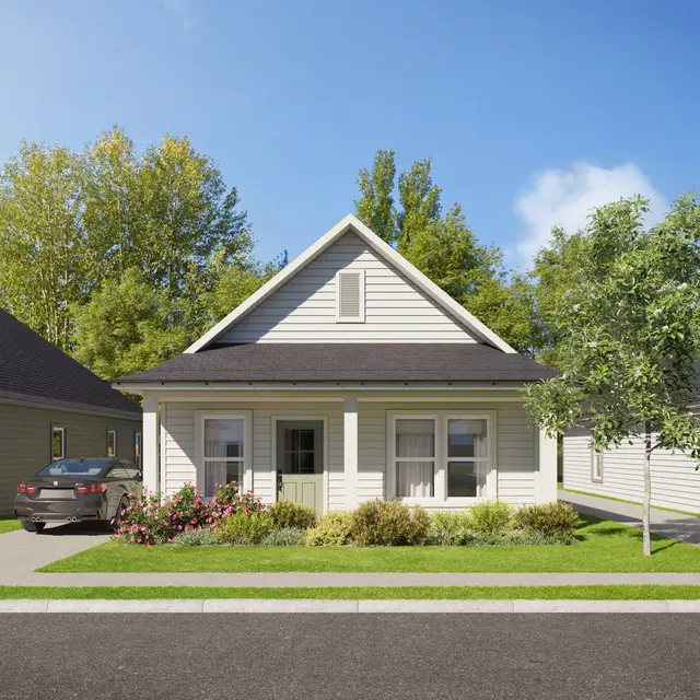 A modern single-story house with a front porch, surrounded by greenery and a paved pathway leading to the street. The house features a gabled roof and light-colored siding, with a car parked in front.