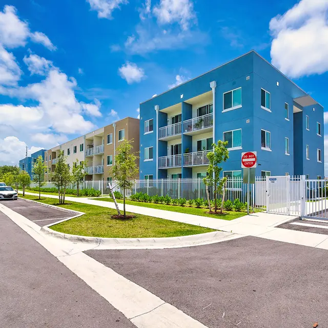 Street-level exterior view of Pine Grove's colorful buildings and entrance. 