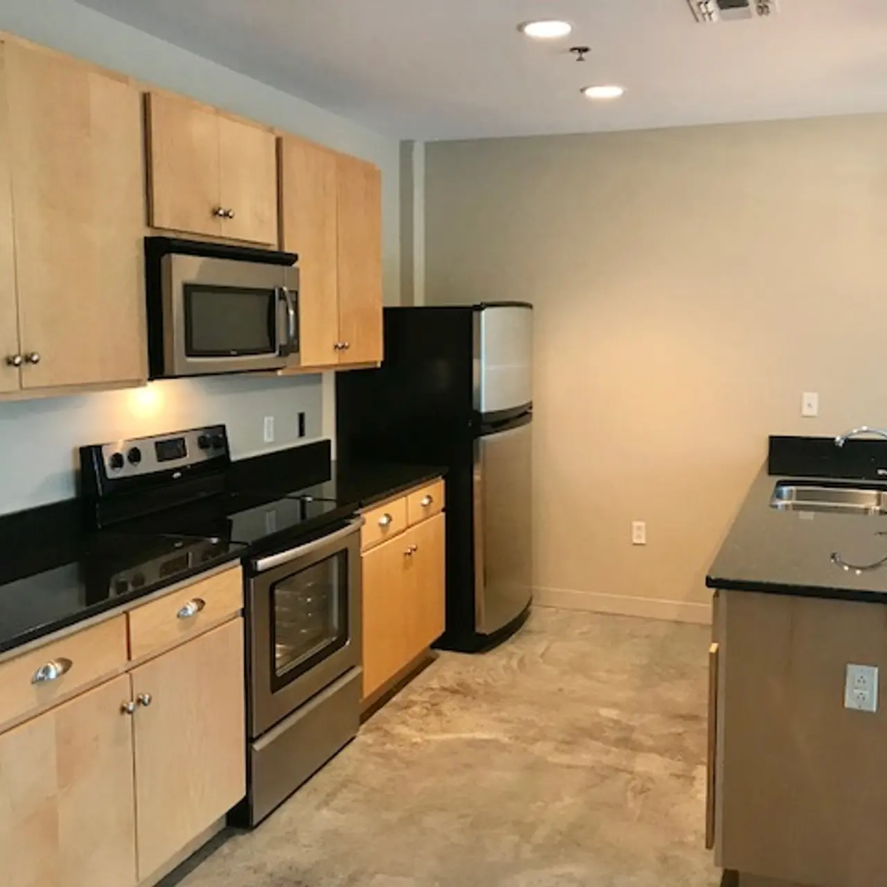 The Marquee at Belle Meade Apartments - Open Floor Plans with Polished Concrete Floors, Stainless Steel Appliances and Granite Counter Tops Throughout