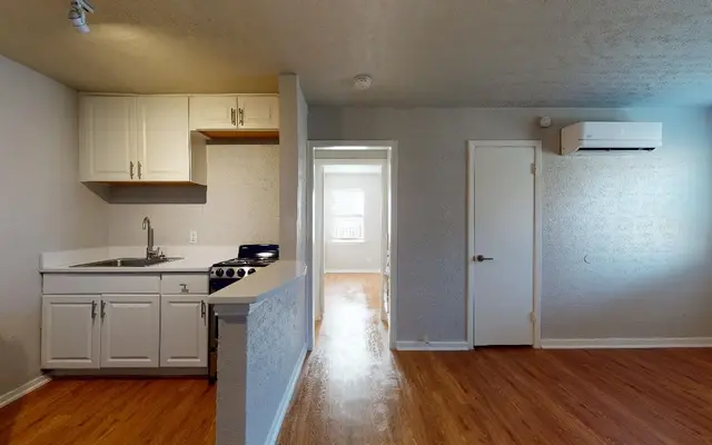 Caracara Apartments - Flooring, Floor, Wood, Kitchen, Living Room