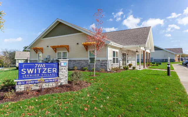 Switzer Senior Villas Exterior Exterior view of Switzer Senior Villas with a large sign in front and well-maintained landscaping.