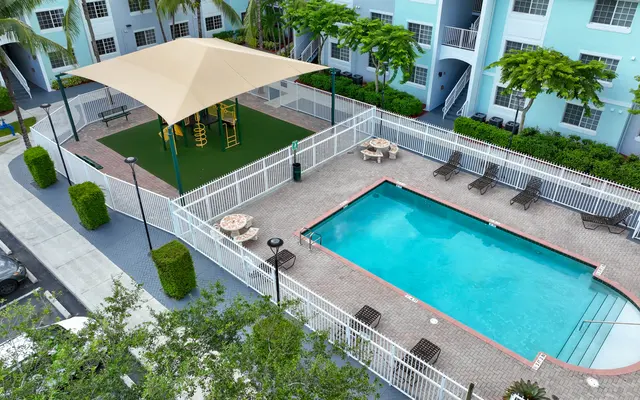 The Corinthian Apartments - Pool, Water, Car