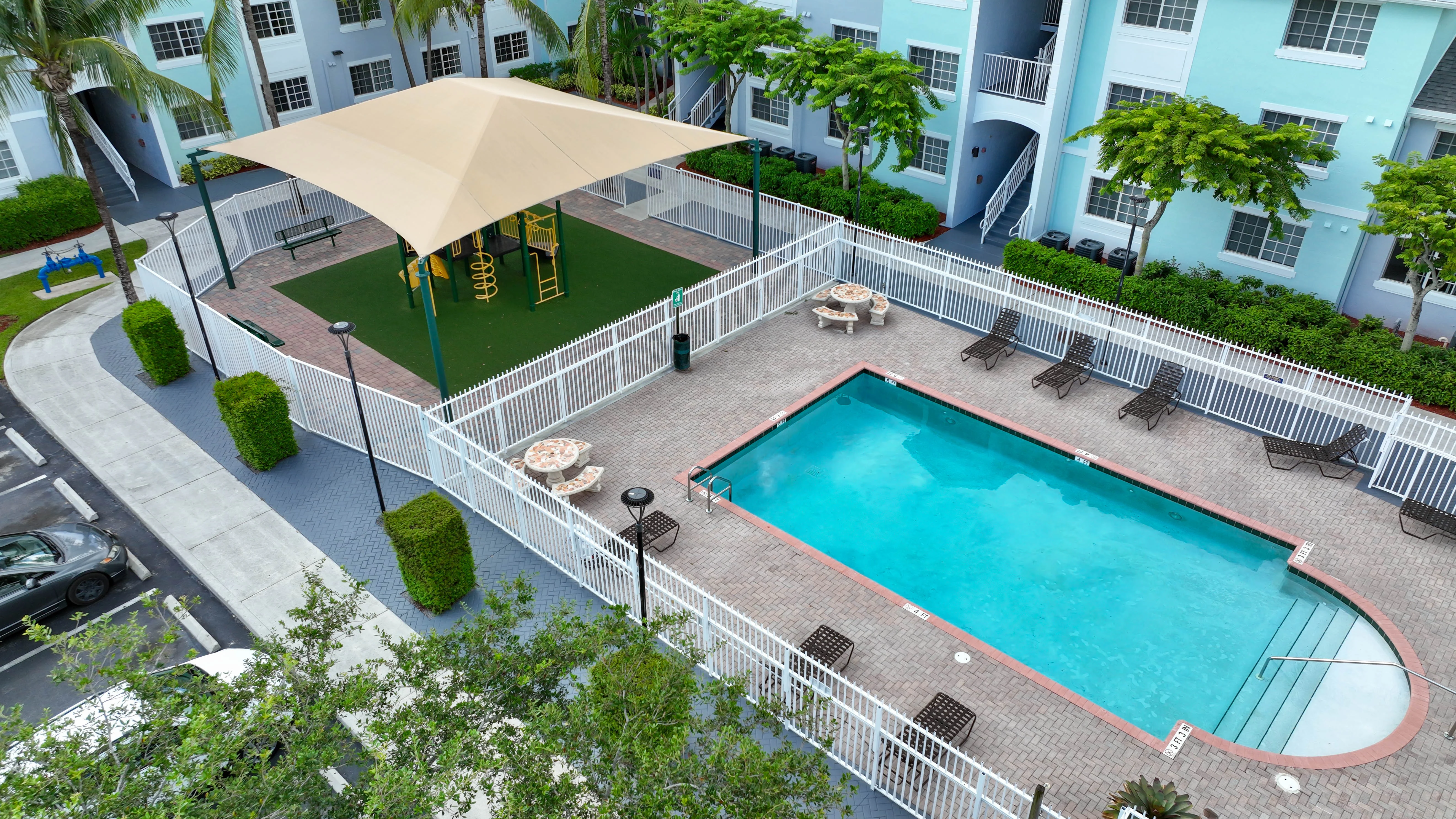 The Corinthian Apartments - Pool, Water, Car