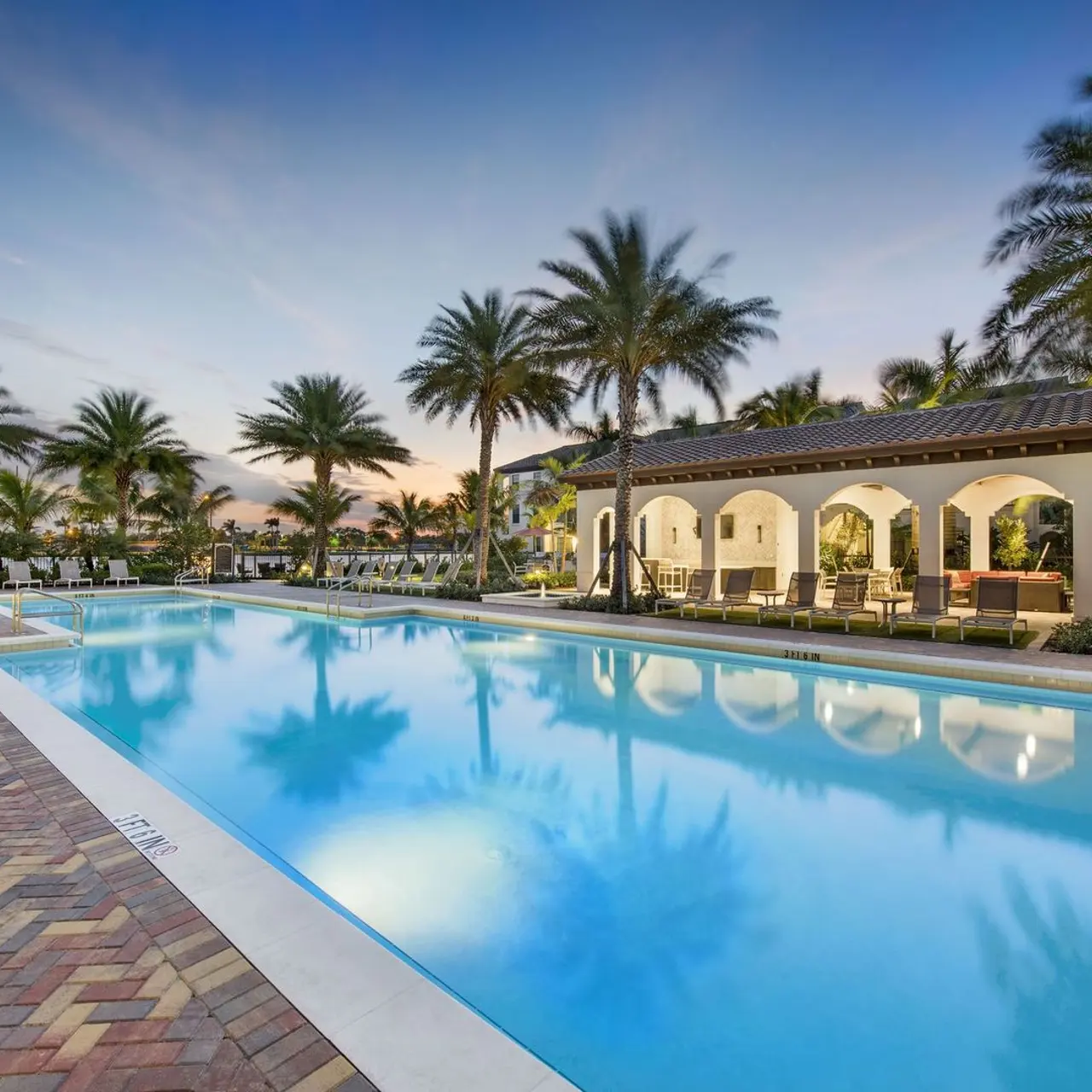 large swimming pool with cabana seating