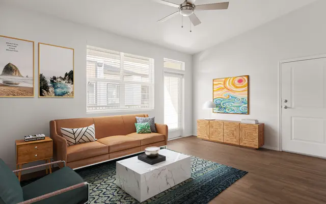 living room with window, balcony door, and wood flooring at apartment in Ewa Beach, HI - Ceiling Fan, Furniture, Rug