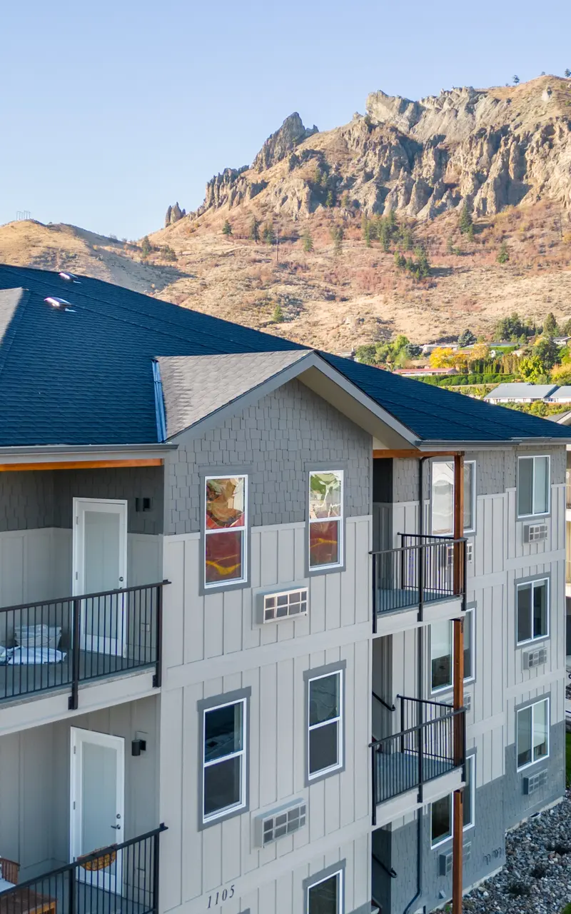 Scenic balcony with expansive views, featuring comfortable seating and surrounded by natural landscapes, offering a tranquil outdoor escape