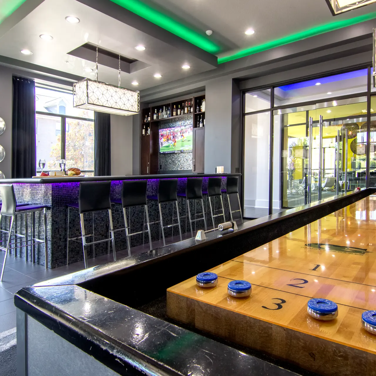 The Pointe Brodie Creek Apartments features a Billiards Lounge with a shuffleboard table. Join us at the bar for free drinks every week for happy hour!