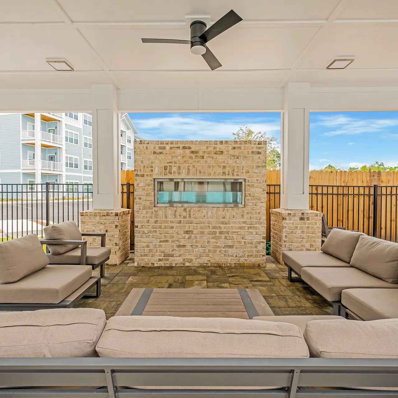 outdoor couch around a fireplace