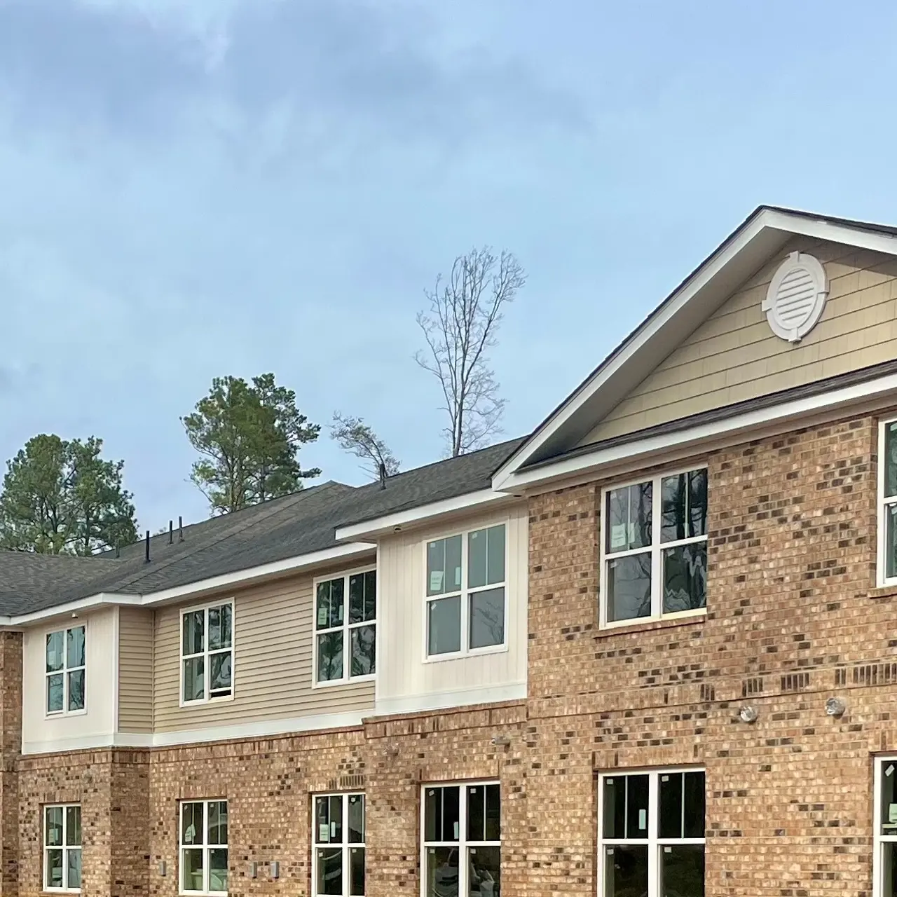 Havens at Oxford - Community - a two story brick building with large windows