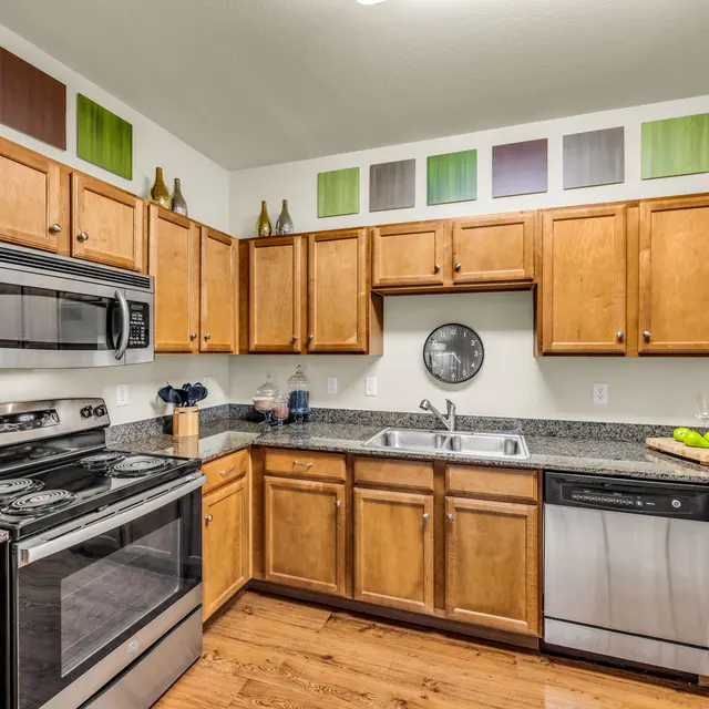 Contemporary Kitchen Design Galley-style kitchen in a South Austin apartment at Agave at South Congress.