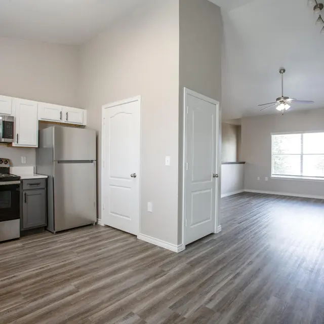 Willow 2x2 apartment homes featuring open-concept living spaces, modern kitchens, spacious bedrooms, and covered parking in a professionally maintained community