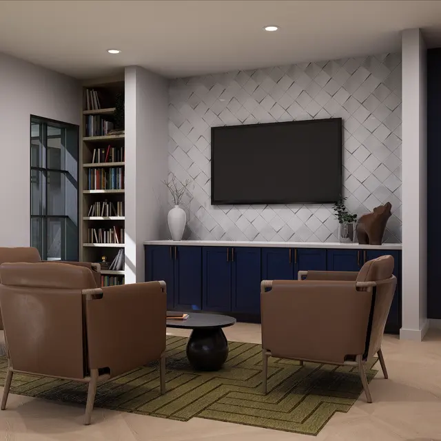 A modern living room featuring two brown armchairs, a black coffee table, and a dark blue cabinet with a television on the white patterned wall. There is a bookshelf filled with books on the left, and green patterned rug on the floor.