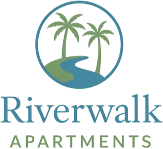 Riverwalk Apartments Logo Logo of Riverwalk Apartments featuring a tropical design with palms and a river.