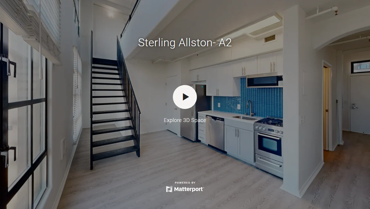 Interior view of a modern apartment showcasing a kitchen, dining area, and staircase.