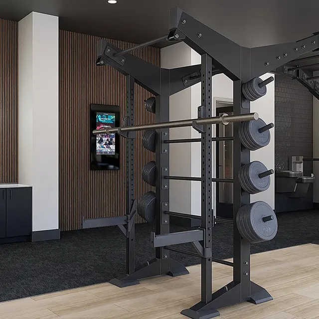Interior of a modern gym featuring workout equipment and motivational signage.