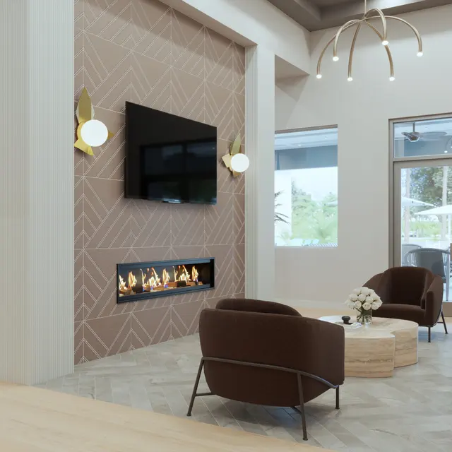 A modern interior living space featuring a cozy seating arrangement, a television mounted above a fireplace, and large windows allowing natural light. Decor includes elegant light fixtures and plants, with a stylish decor aesthetic.
