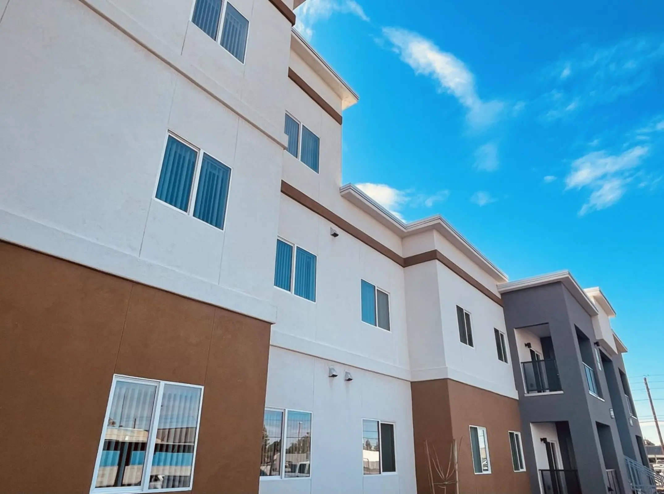 Apartment building side with windows.