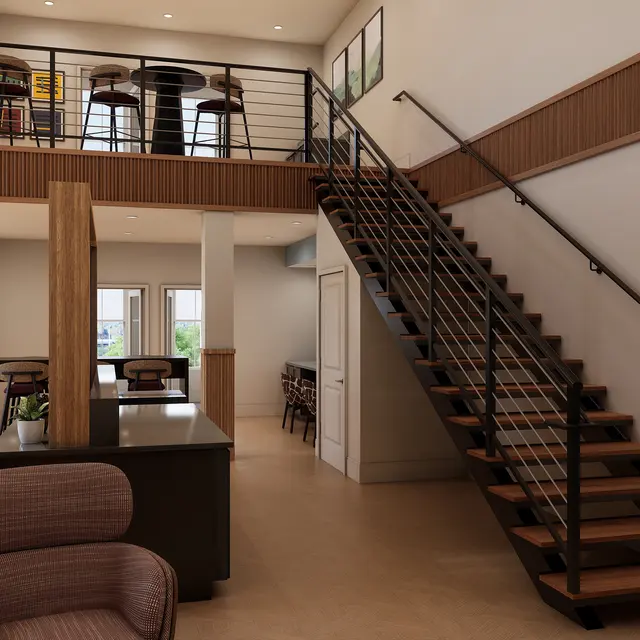 An interior space featuring a modern design with a staircase, seating area, and bar tables. The decor includes wooden accents and a spacious layout.