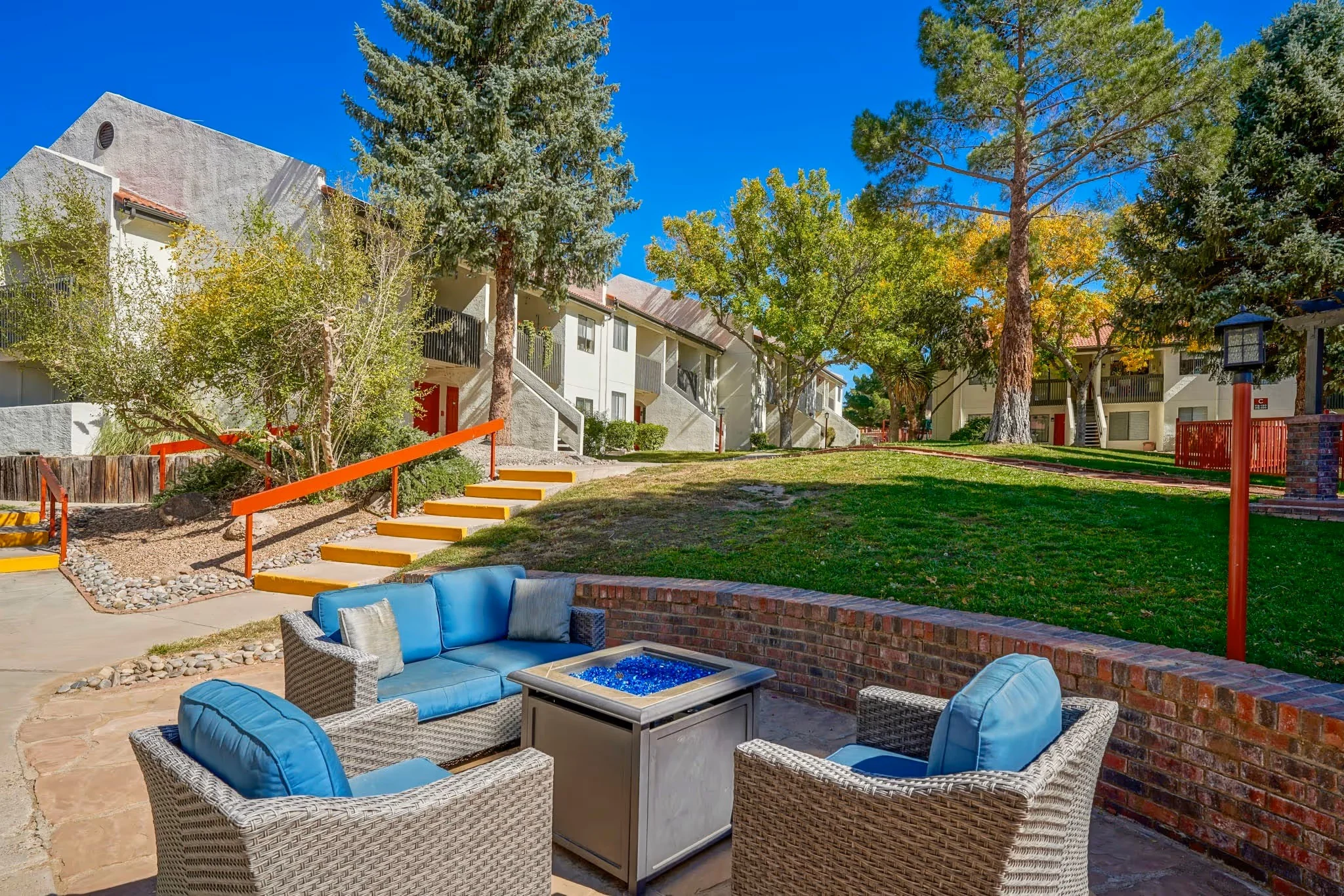 Outdoor communal area with seating and landscaped grounds.
