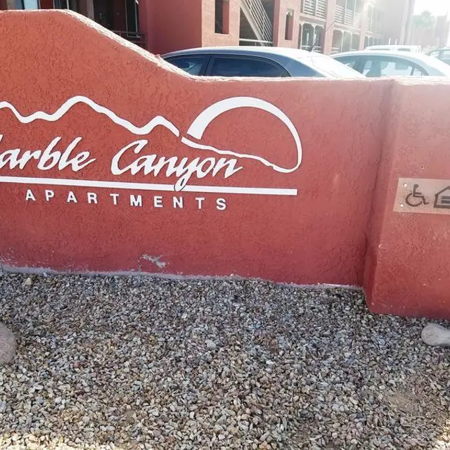 Marble Canyon Apartments Sign Sign for Marble Canyon Apartments featuring text and symbols for accessibility.