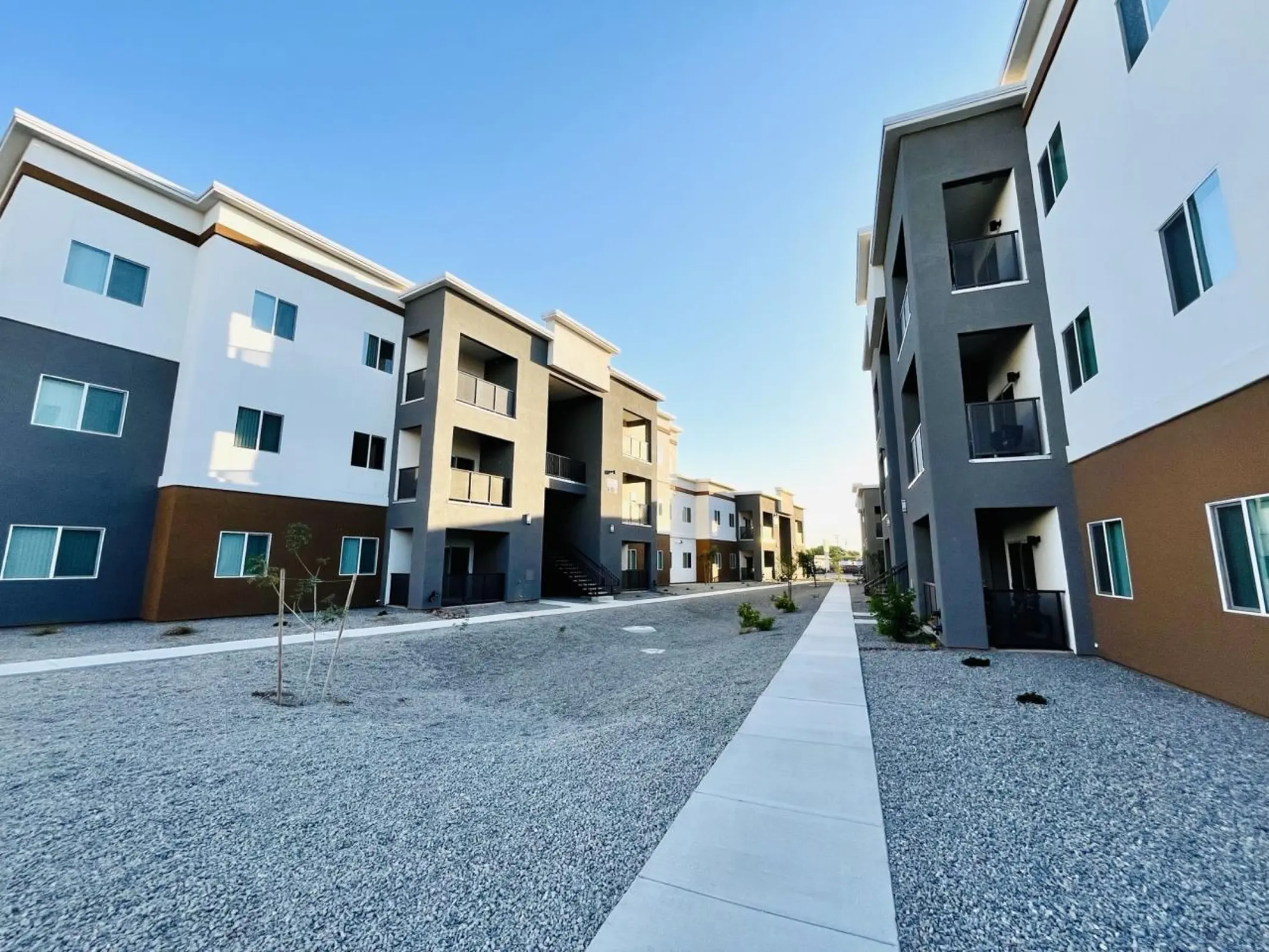 Walkway between three-story buildings.
