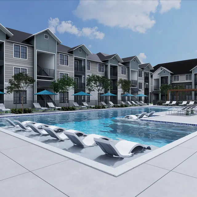 A modern apartment complex featuring a large swimming pool with lounge chairs, surrounded by greenery and umbrellas for shade.