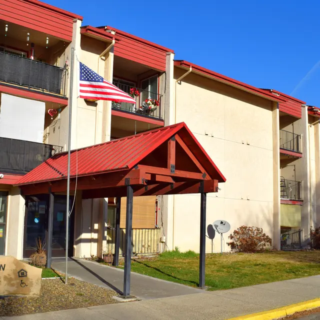 Parkview Center Building Exterior Exterior view of the Parkview Center building featuring a red roof and American flag.
