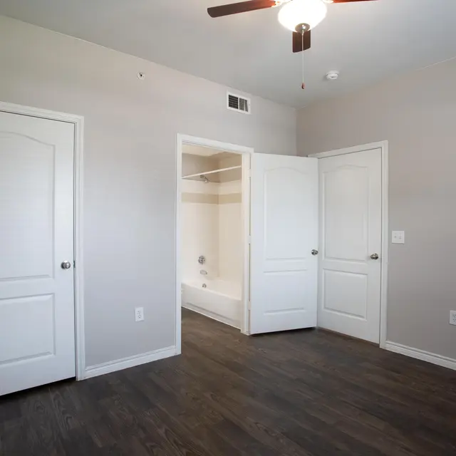 Willow 2x2 apartment homes featuring open-concept living spaces, modern kitchens, spacious bedrooms, and covered parking in a professionally maintained community