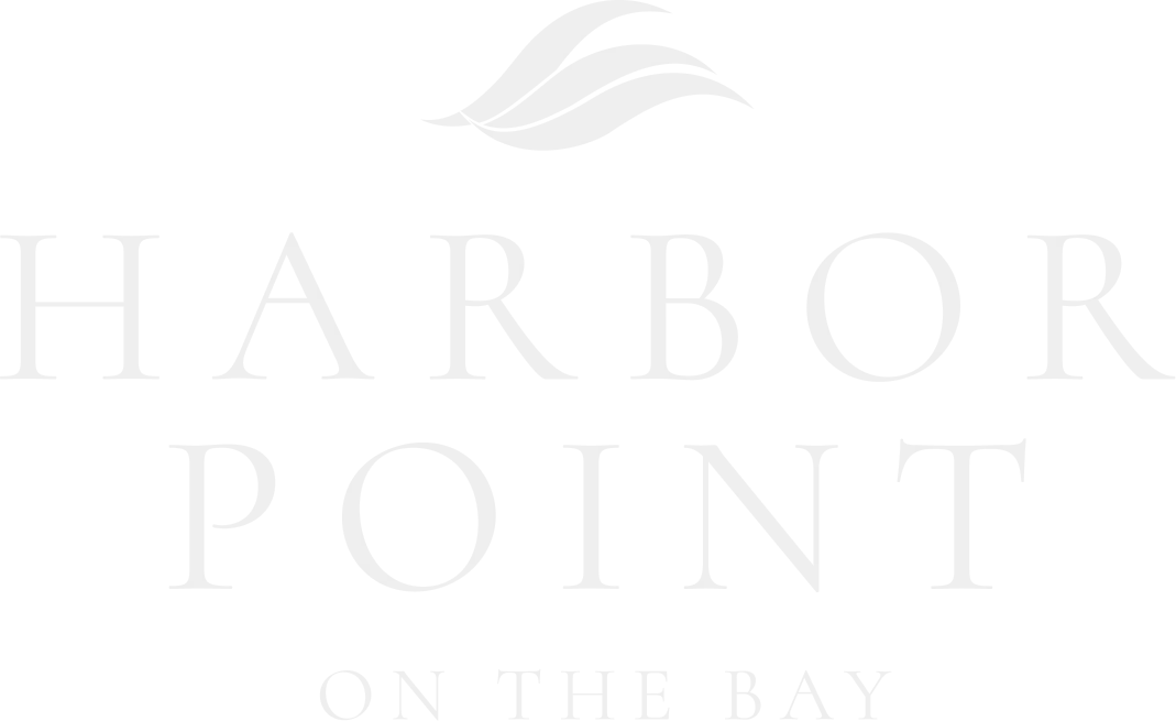 Logo for Harbor Point on the Bay featuring elegant typography and a leaf graphic.
