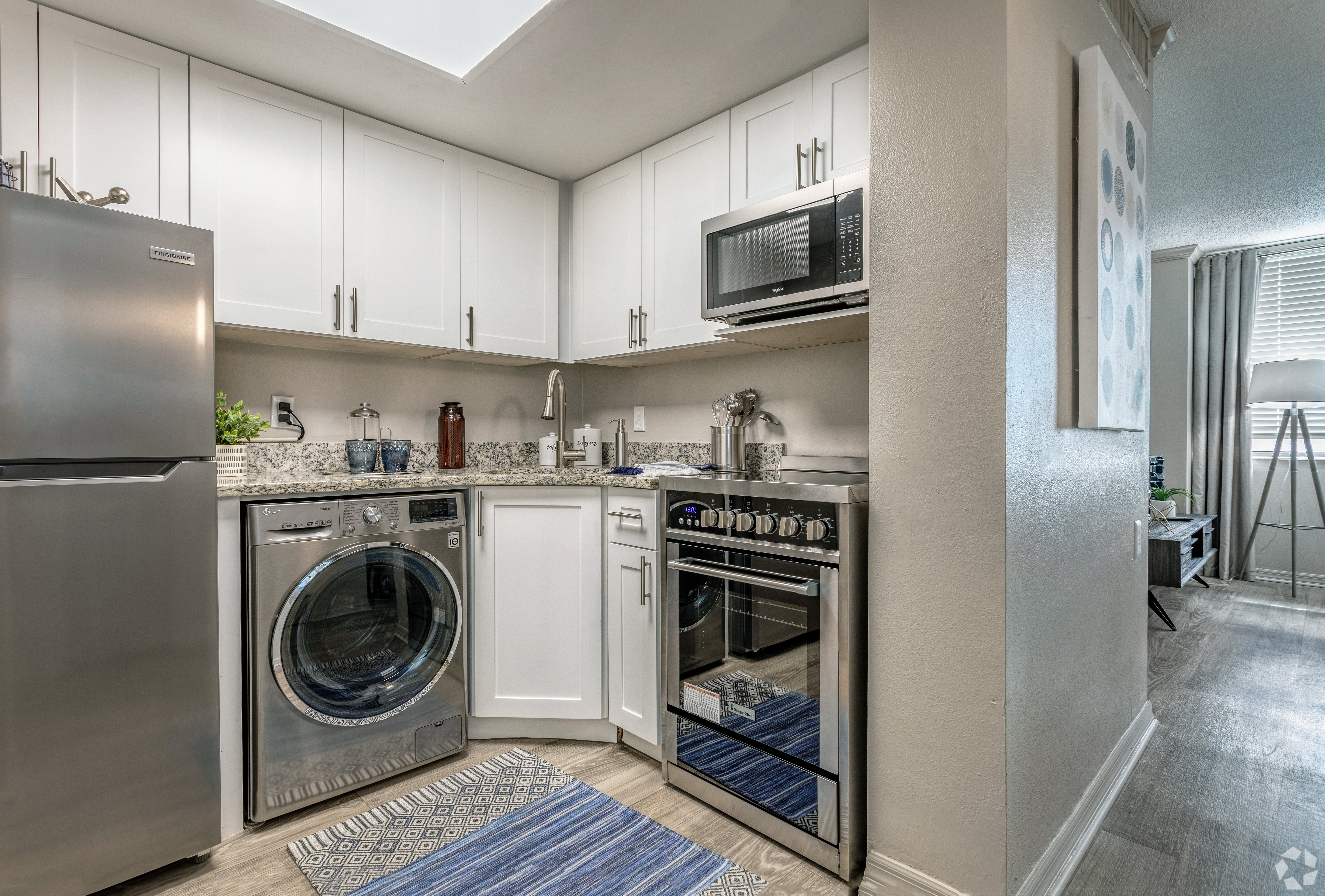 Modern Kitchen Design A modern kitchen with stainless steel appliances and white cabinetry.