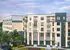 A modern multi-story apartment building with a blend of brick and wood exteriors, featuring large windows and balconies, surrounded by landscaped greenery.