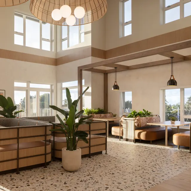 Stylish Modern Lobby A spacious and well-lit modern lobby featuring large windows, comfortable seating areas, and decorative plants. The interior design includes a mix of textures with a focus on natural materials and soft lighting.