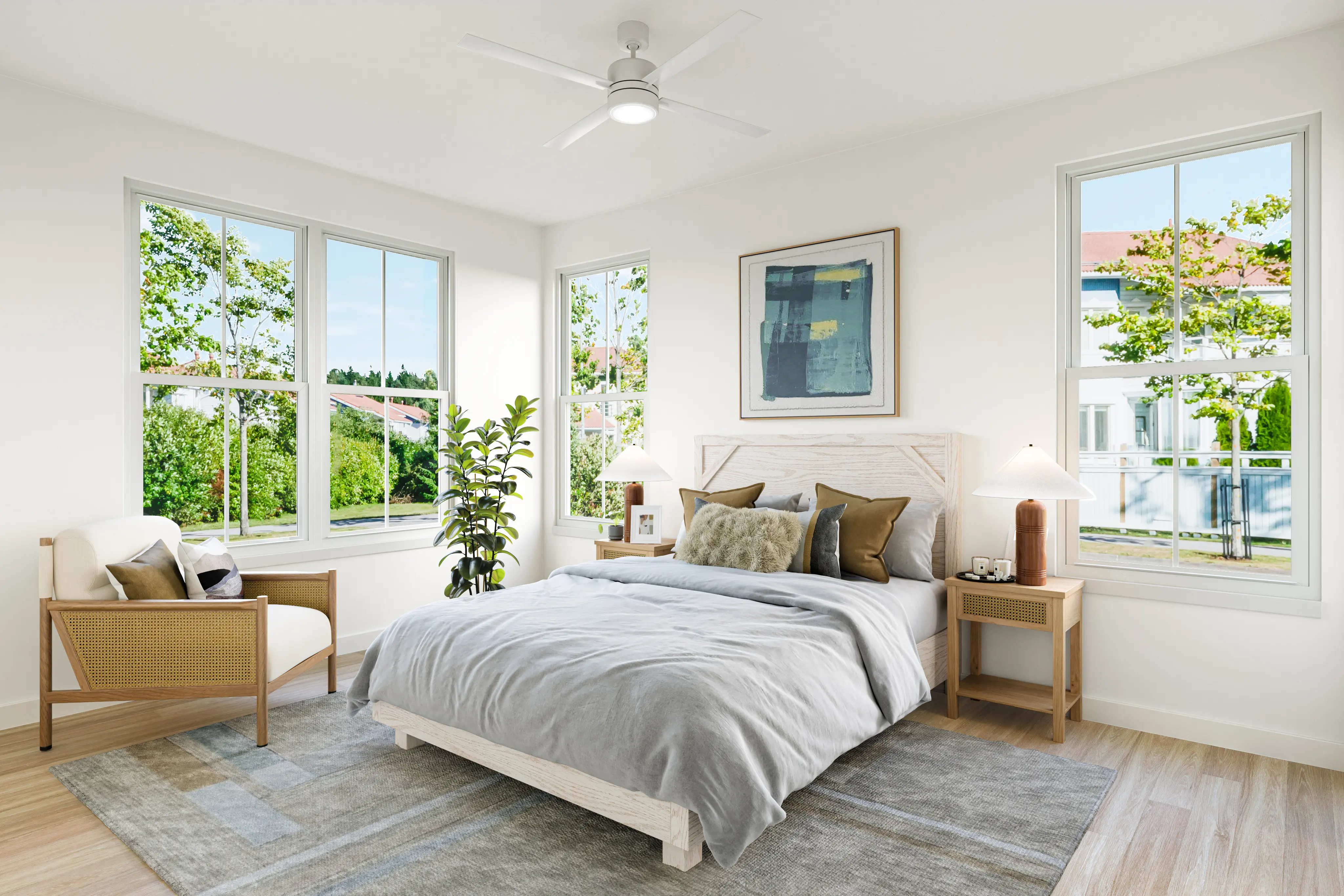 A modern bedroom featuring a comfortable bed with gray bedding, two bedside tables with lamps, a cozy armchair, potted plants, and multiple windows allowing natural light to fill the space.