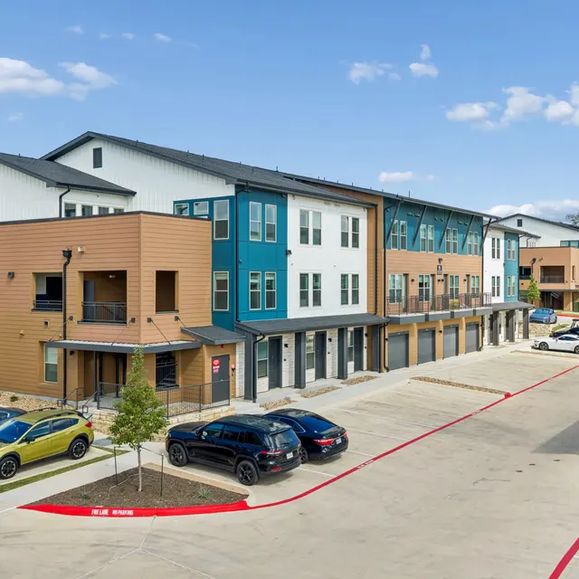 Modern Apartment Complex Exterior Exterior view of a modern apartment complex with multiple units