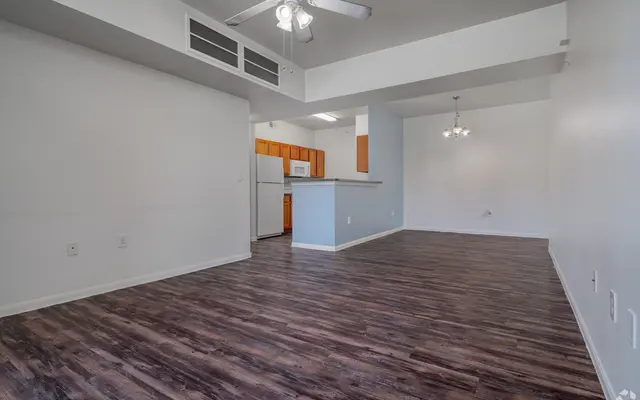 Spacious Apartment Interior Interior view of a spacious apartment with wooden flooring, light walls, and modern fixtures.