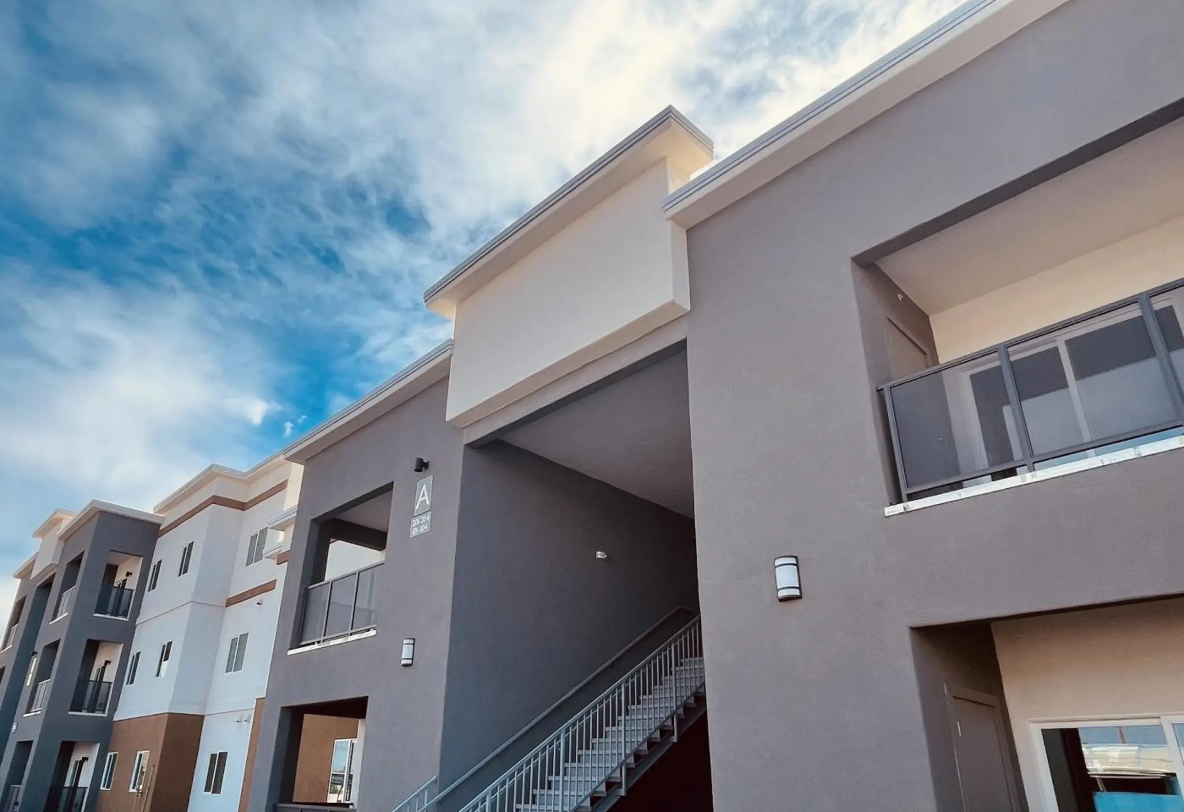 Building A exterior with stairs and balconies.