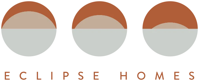 Eclipse Homes Logo Logo of Eclipse Homes featuring stylized half-circle graphics in orange and white.