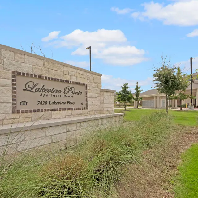 Lakeview Pointe Apartments Sign Sign for Lakeview Pointe Apartments located at 7420 Lakeview Pkwy surrounded by landscaped green space.
