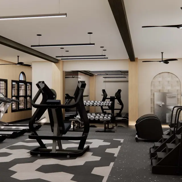 Interior of a Modern Gym Interior view of a modern gym with treadmills, weights, and fitness equipment